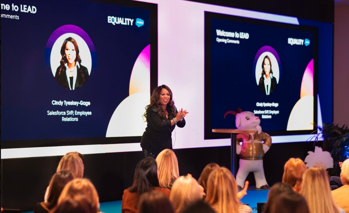 Cindy Tyeskey-Gage presenting on stage at a Salesforce LEAD and Equality leadership event