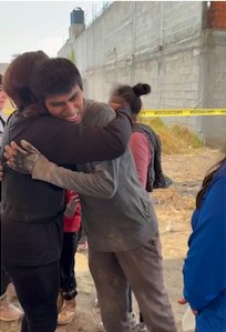 Cindy Tyeskey-Gage embracing a volunteer at the Habitat for Humanity build