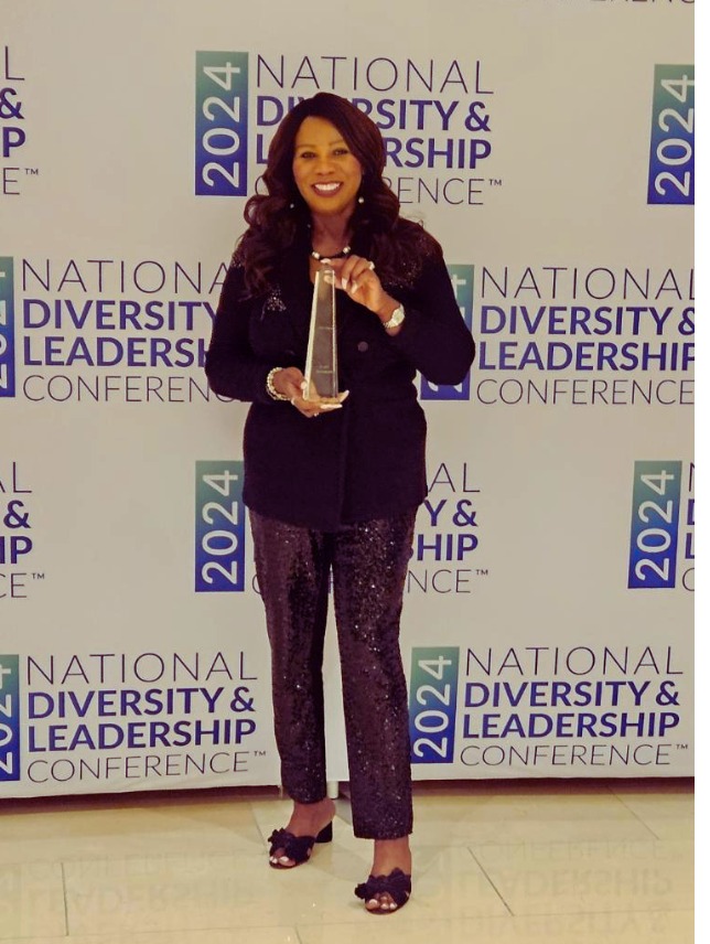 Cindy Tyeskey-Gage accepting an award at the National Diversity & Leadership Conference